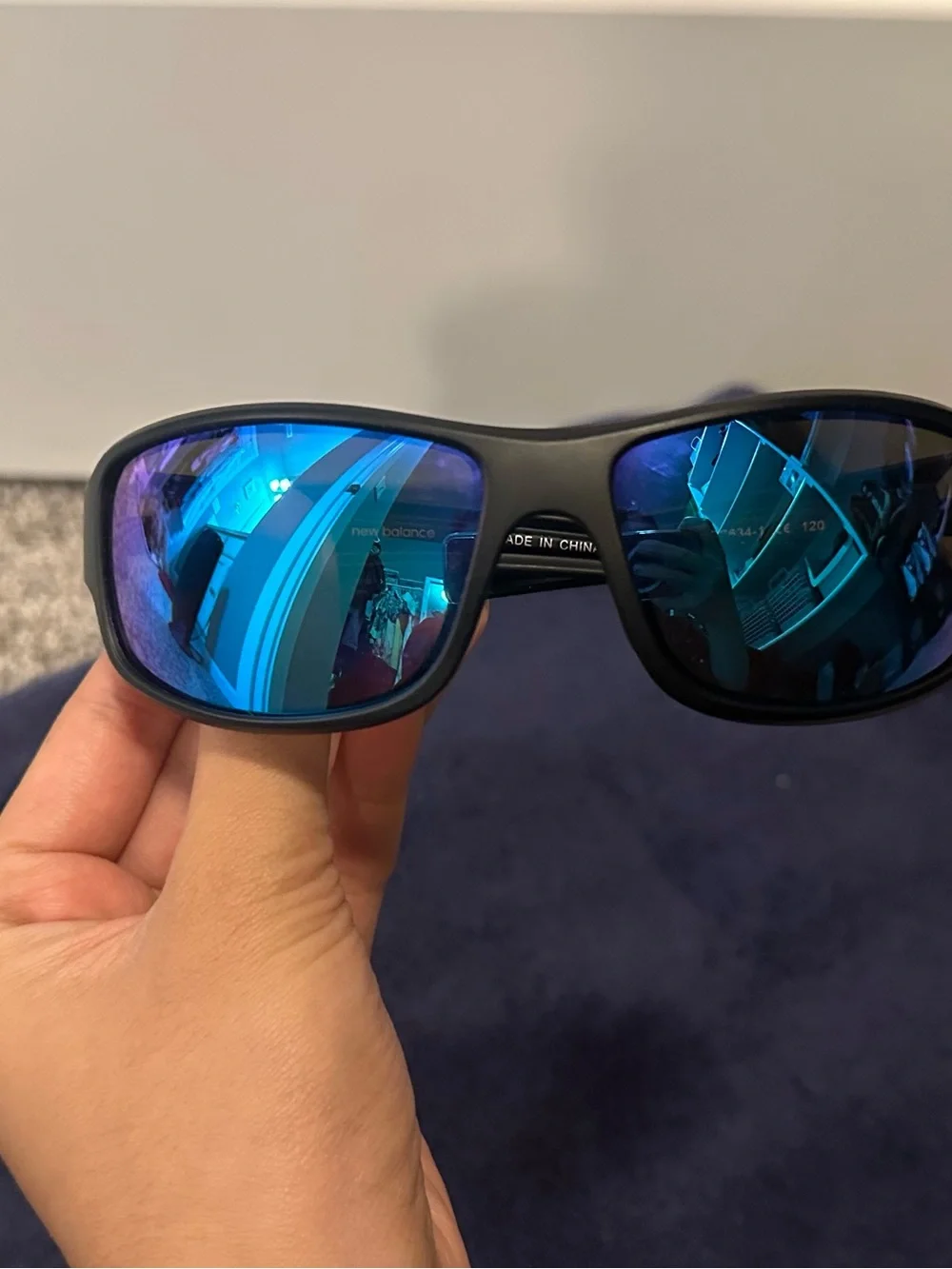 New Balance Black Frame Sunglasses with Blue Mirror Lenses